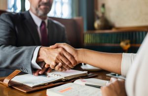 Lawyer shaking hands with client